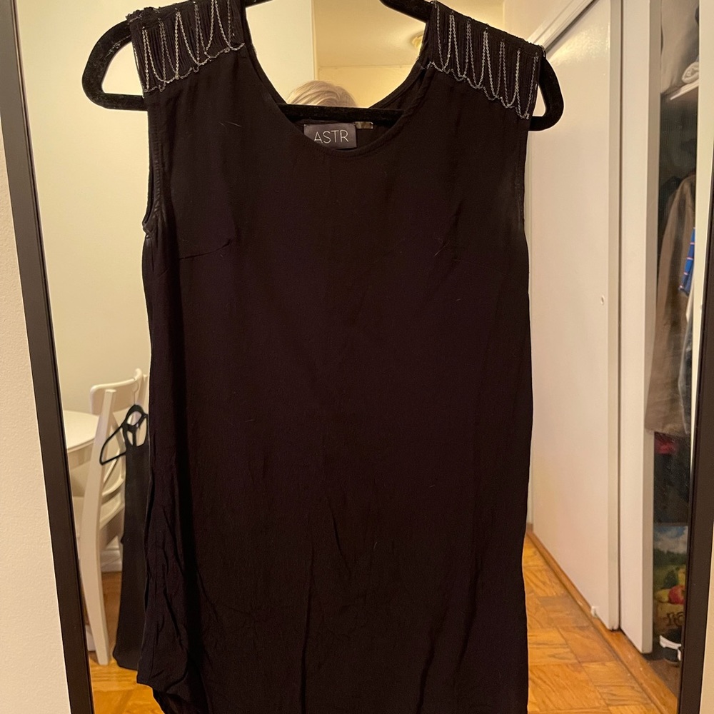Black mini dress with metal tassels at shoulders
